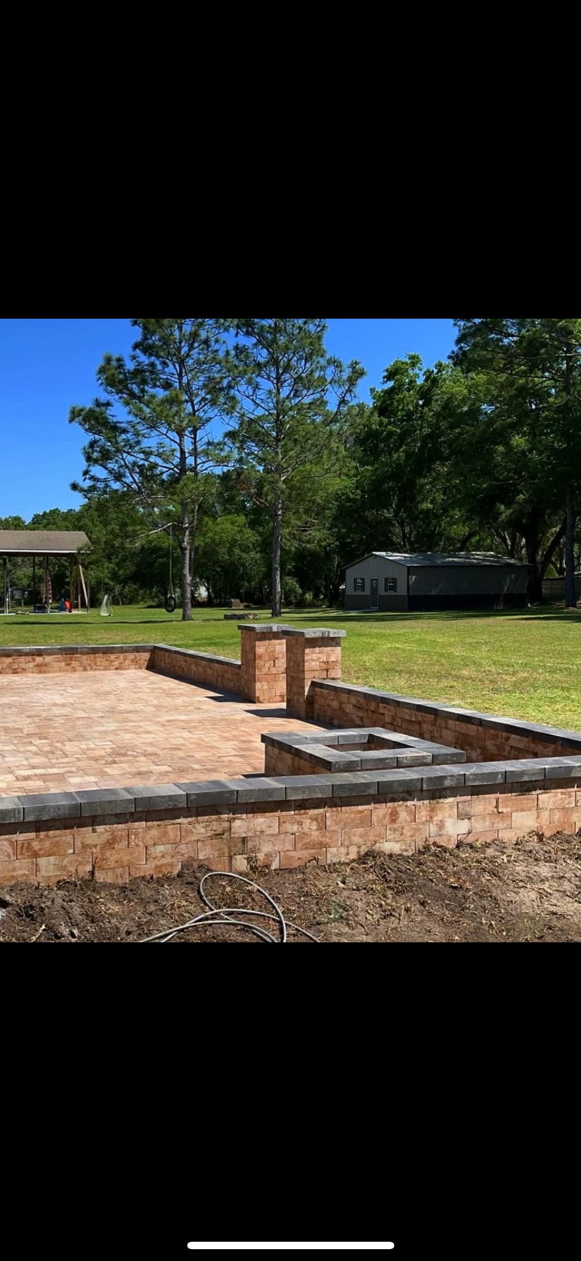 Project Stunning Outdoor Living Space with Paver Patio and Firepit Area image